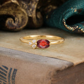 0.5ct Oval Garnet Ring with Side Stone Modern Promise Look